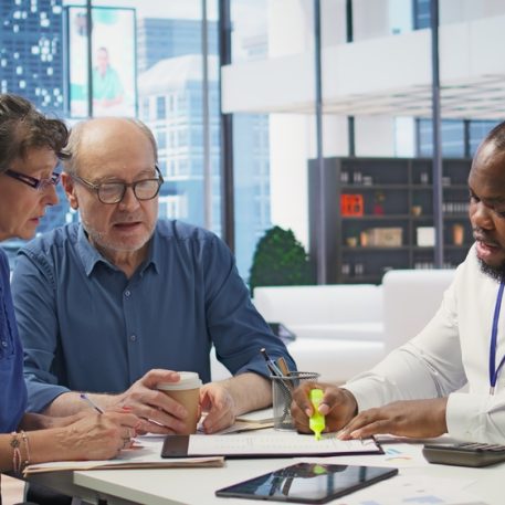 Senior,People,Consulting,With,Their,Financial,Banker,About,Retirement,Plans,